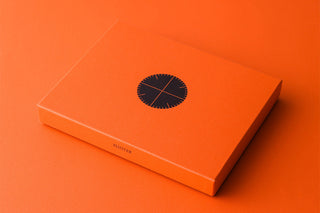 PLOTTER A5 binder box with circular logo label on orange packaging.
