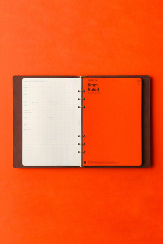 PLOTTER Pueblo A5 6-ring leather binder, brown, open with ruled pages
