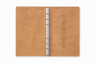 Beige leather binder bible size, open with silver 6-ring spine