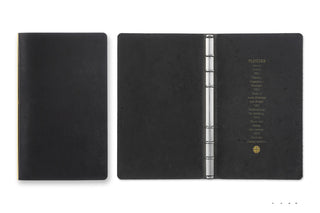 Black leather 6-ring binder open, with metal ring mechanism and lined pages