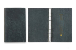 Navy leather 6-ring binder open, showing metal ring mechanism