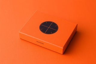 Orange Plotter branded gift box with circular dark label