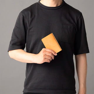Black mini leather 6-ring binder held in hand