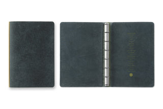 Dark navy 6-ring leather binder mini, open with metal rings and page insert panels