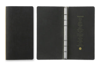 Open black leather 6-ring binder with chrome rings and printed inner cover