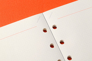 2mm grid memo pad refill sheet corner with punched holes on white graph paper