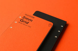 Orange 2mm grid refill memo pad with black cover and ring holes