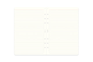 Open memo pad refill showing two white ruled pages with center spine and binder holes