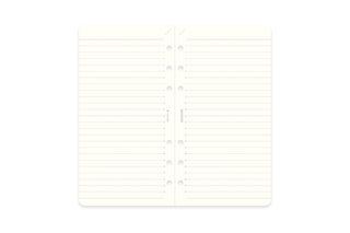 Open memo pad refill spread with ruled pages and punched binder holes, white paper
