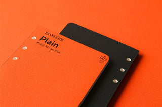 PLOTTER Plain refill memo pad covers stacked: orange front, black back