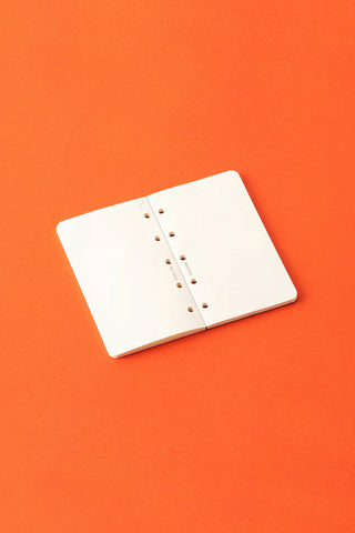 White memo pad insert with punched binding holes and red dot markers