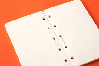White memo pad insert, centered punched holes along two binding edges