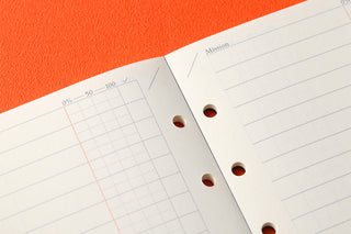 Close-up of To Do List refill memo pad pages showing perforated holes and grid