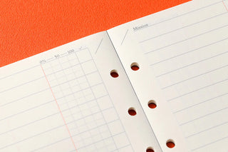 To Do List memo pages with grid chart lines and ring holes in white paper