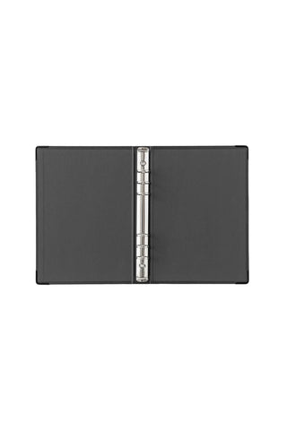 A5 refill storage binder open, showing metal ring spine and dark covers