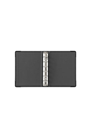 Mini refill storage binder, open showing metal ring mechanism and dark pages