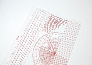 A5 ruler pad close-up showing protractor, gridlines, and measurement marks