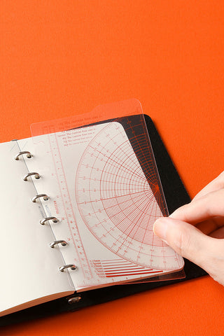 Mini ruler pad with transparent protractor overlay and printed measurement lines