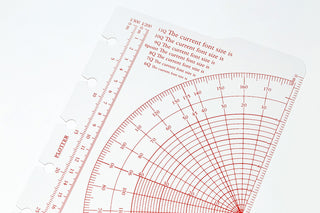 Close-up of mini protractor scale with red and black measurement markings