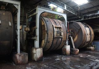 6-ring leather binder not visible in this frame; industrial barrels shown