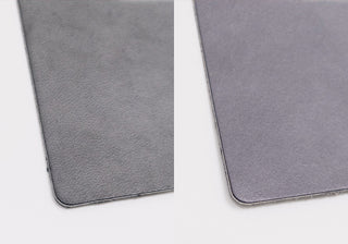 Blue-gray leather binder cover corner with rounded edge and textured surface