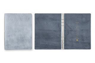 A5 leather 6-ring binder opened flat with metal rings and blue-gray covers