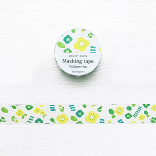 Washi tape roll with small green and yellow flower pattern on white backing