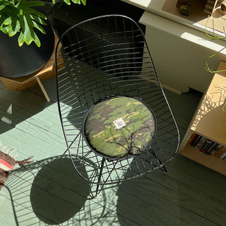 Round woodland camo seat pad on metal chair frame with black edge