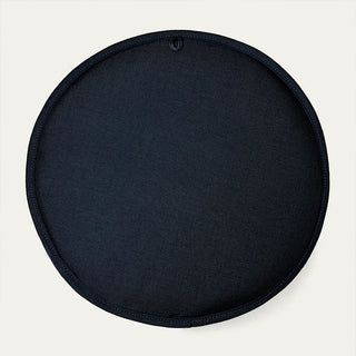 Round dark seat pad with stitched black rim and hanging loop