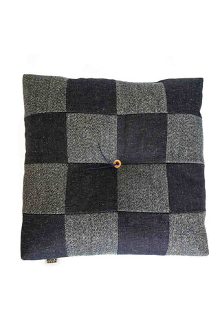 Indigo denim patchwork cushion with salt-and-pepper check pattern and small button