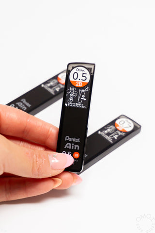 Pentel AIN STEIN 2B lead refill, 0.5mm, shown with loose lead piece