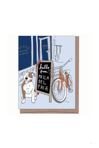 Greeting card with hand-drawn city illustration, dog holding sign, bicycle, and 'hello' text