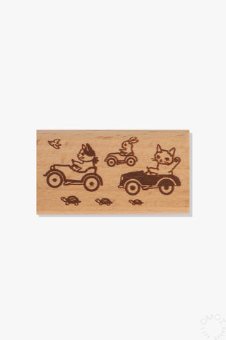 Large wooden stamp set with pottering cat and small tractor designs, in light brown