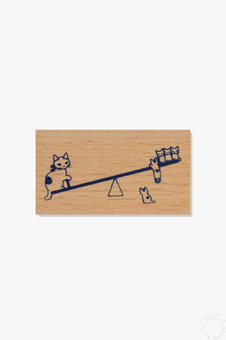 Large wooden stamp with cat seesaw design