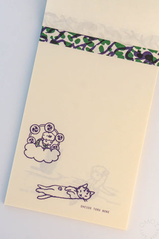 Beige cat memo pad with green patterned top strip and cats climbing on a box