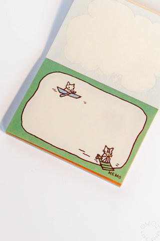 Green cat mini memo pad with outlined cloud shape and small cats in corners