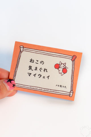 Orange cat mini memo pad held in hand, framed cat and small red heart