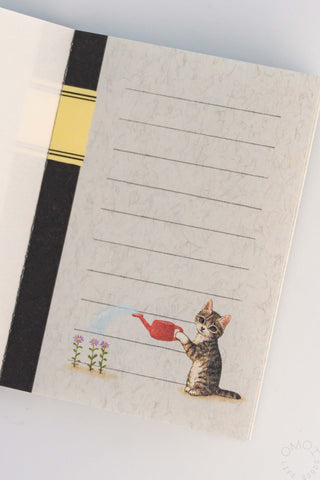 Mini note memo sheet with cat by red watering can and five ruled writing lines
