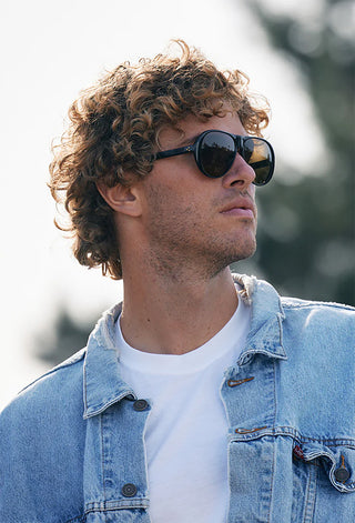 Black sunglasses with dark lenses on a man