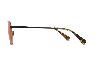 Sunglasses side profile with rose-tinted lens and tortoise-pattern temples, gold accents