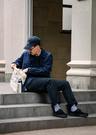 Blue and white checkerboard socks with striped toe and heel