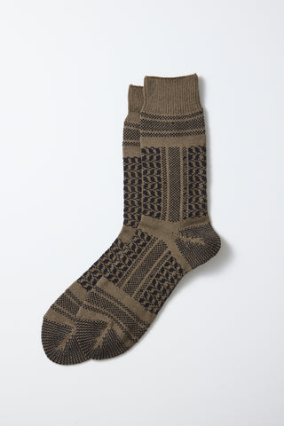 Crew socks with desert-style knit pattern in dark brown with muted olive and black stripes