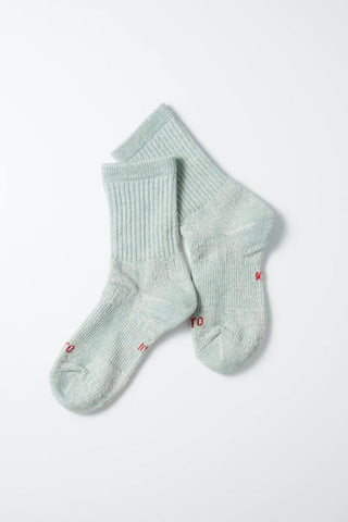 Pair of light blue mini crew socks; ribbed knit with small red logo embroidery.