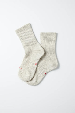 Pair of light gray mini crew socks; ribbed knit with small red logo embroidery.