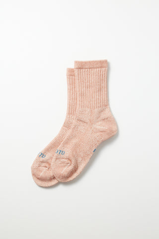 Salmon mini crew sock; ribbed knit with small embroidered logo at the toe.