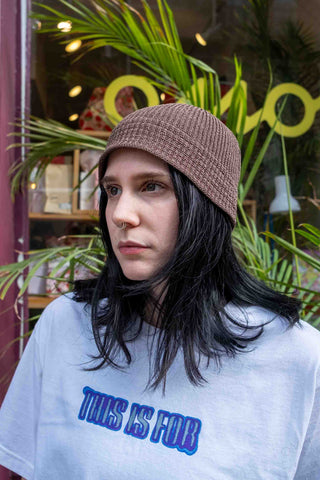 Apricot flax-touch knit beanie hat with ribbed texture and cuffed brim