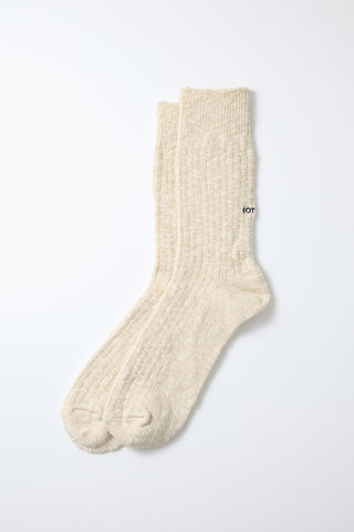 Ecru slub-knit crew sock with ribbed ankle cuff and cushioned sole