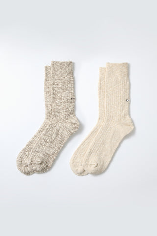 Pair of slub-knit crew socks in mocha and ecru, ribbed cuffs and cushioned toe/heel