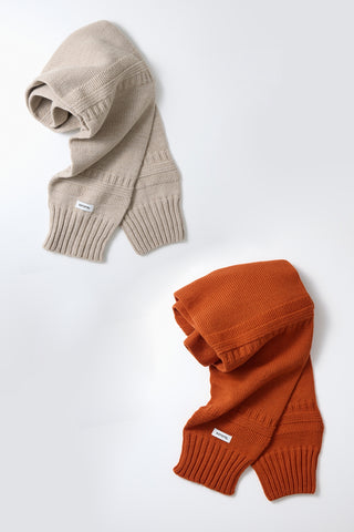 Light beige knit sweater sleeve muffler, folded cuffs and ribbed knit trim.