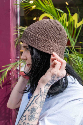 Apricot flax-touch knit beanie hat with ribbed texture and rolled brim
